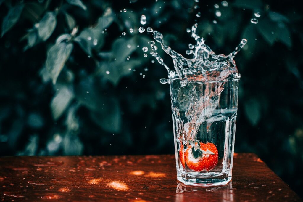 Close Up Photo of Water Splashing from Glass